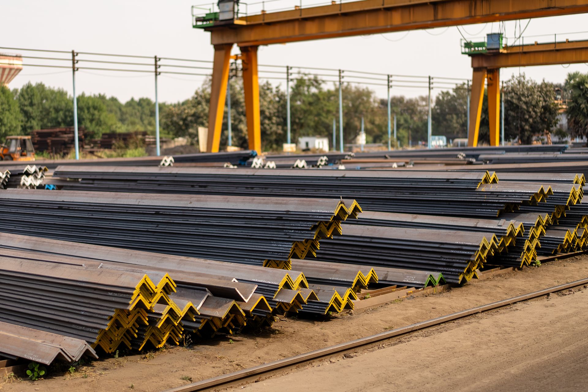 Structural steel sections stacked in a supply yard